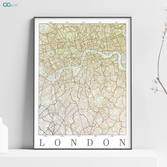 a map of london on a shelf next to a vase