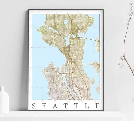 a framed map of seattle with a vase of flowers