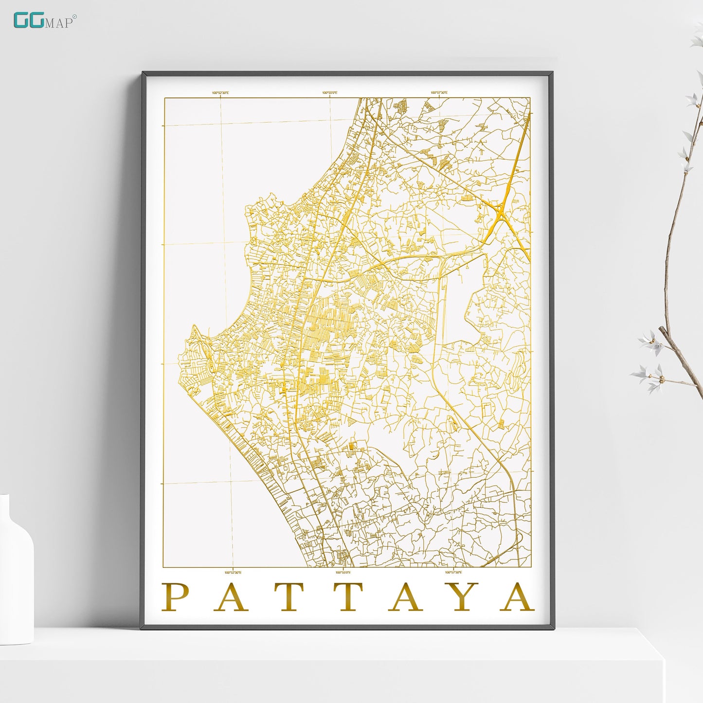 a map of pattaya in gold on a white shelf