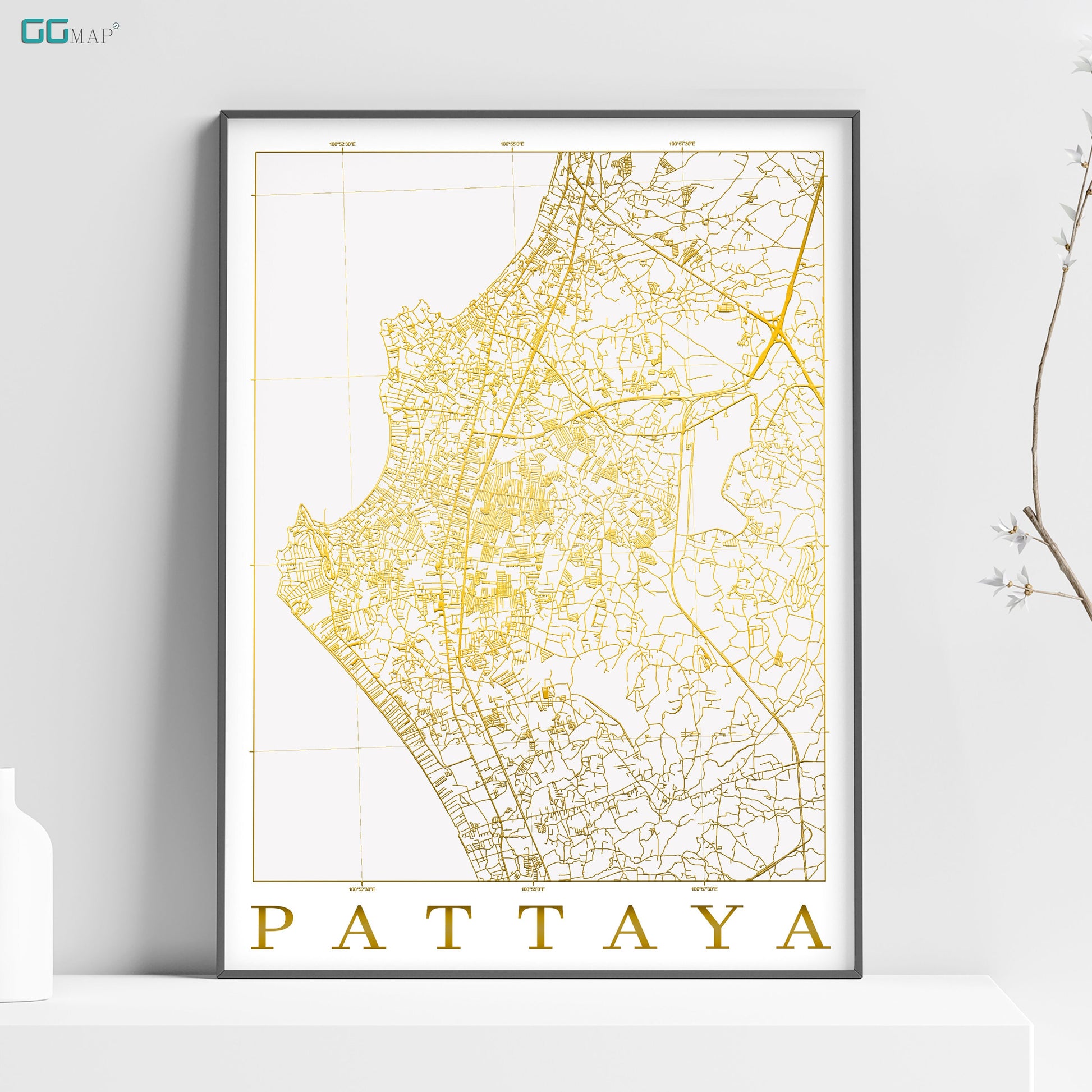 a map of pattaya in gold on a white shelf